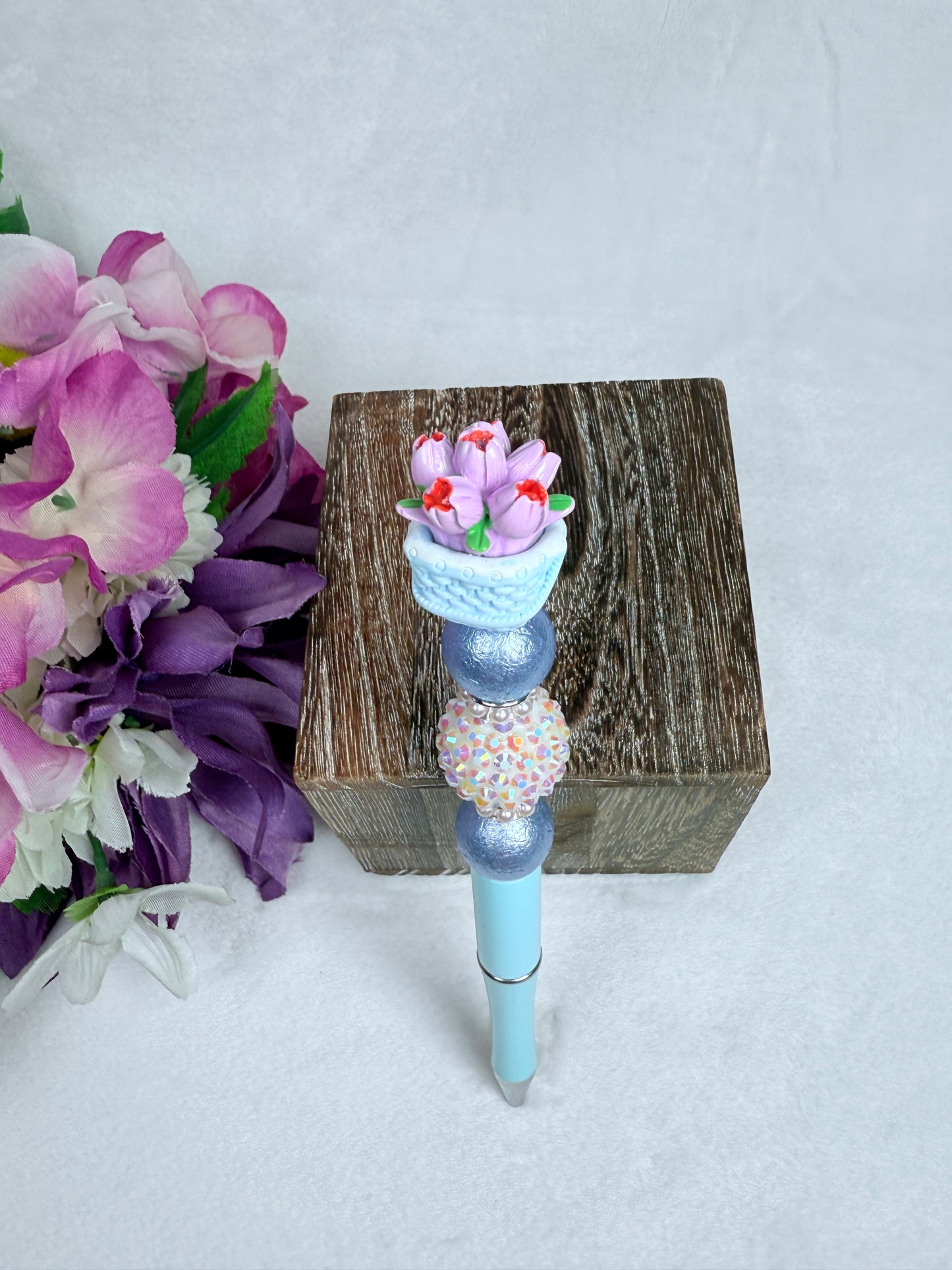 Tulips in a Basket with Blue Pen Barrel